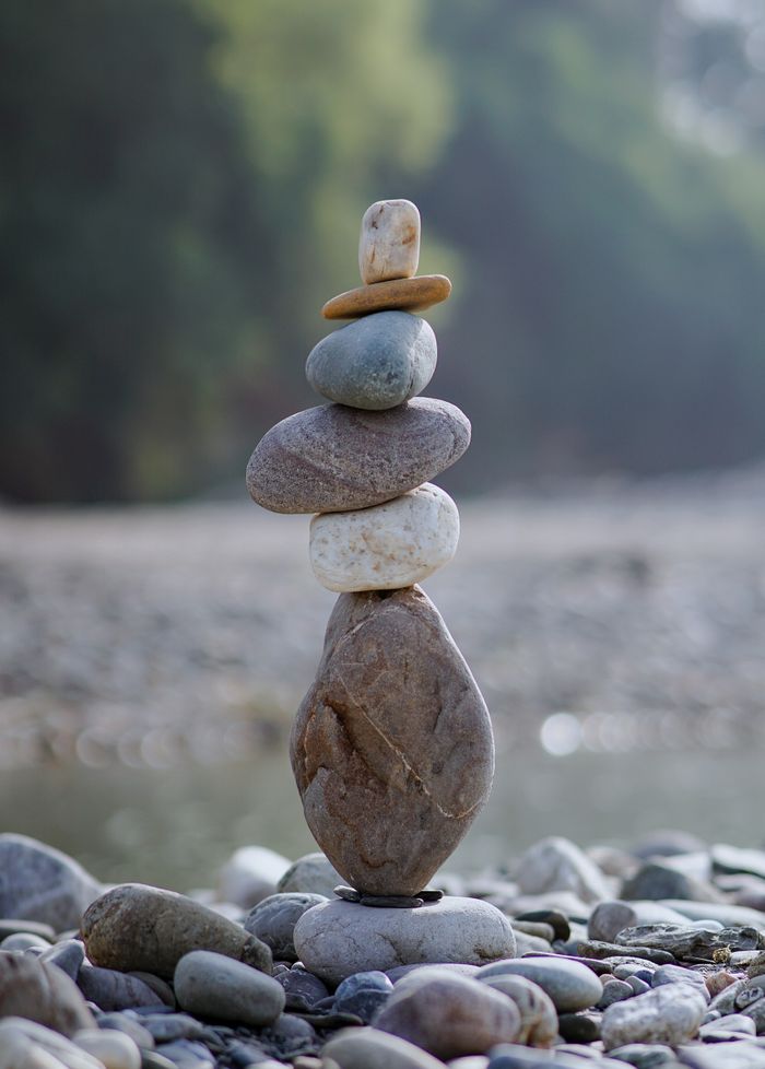 Mastering the First Impression: Your intriguing post title goes here Stacked pebbles on a riverbank symbolize balance and tranquility in nature.